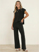 First Class Travel two-piece set in soft viscose-acrylic blend with pleated wide-leg pants and matching top for wrinkle-resistant, versatile comfort