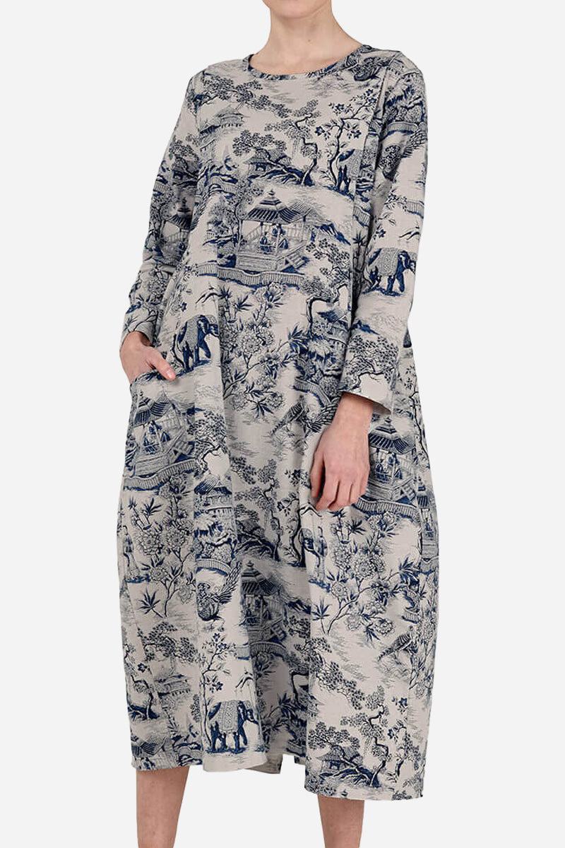 Japanese porcelain print midi dress with rounded neckline, 3/4 sleeves, oversized pockets, and loose fit.
