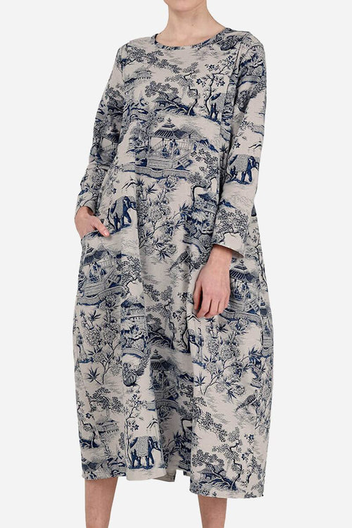 Japanese porcelain print midi dress with rounded neckline, 3/4 sleeves, oversized pockets, and loose fit.