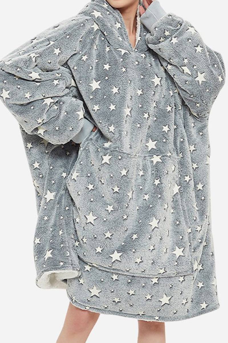 Oversized gray Lazy Fleece Blanket Sweater with white star pattern, hood, and front pocket, made of soft fleece and sherpa fabric for warmth and comfort.