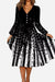 Loose waist long sleeve black and white V-neck dress with button details and flared skirt