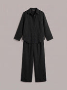 Model wearing an oversized 100% cotton shirt and wide-leg pants co-ord set in a relaxed, breathable outfit