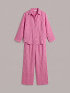 Model wearing an oversized 100% cotton shirt and wide-leg pants co-ord set in a relaxed style