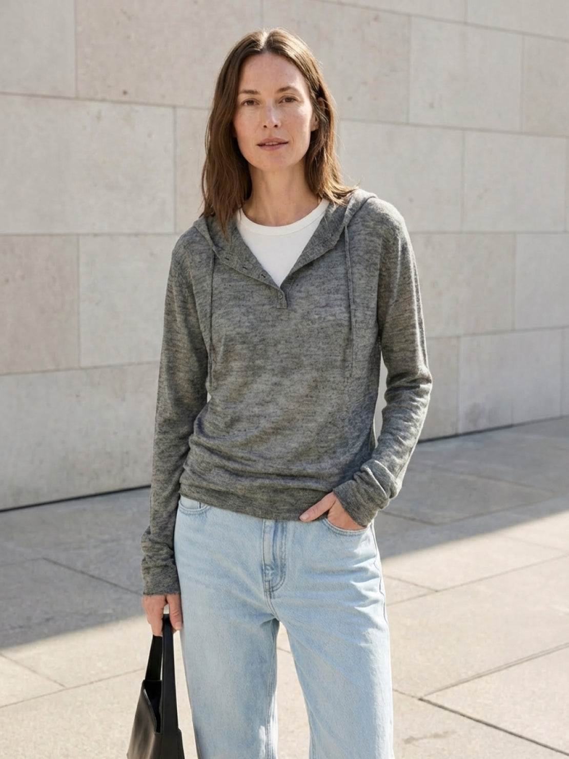 Organic Linen Henley top in fine knit with relaxed fit, 3-button placket, long sleeves, side slits, and breathable fabric.