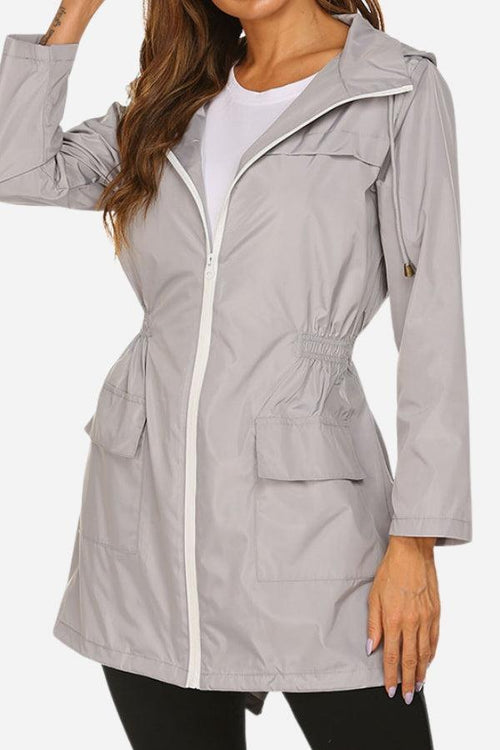 Lightweight gray outdoor and travel hooded raincoat windbreaker jacket with front zipper and pockets