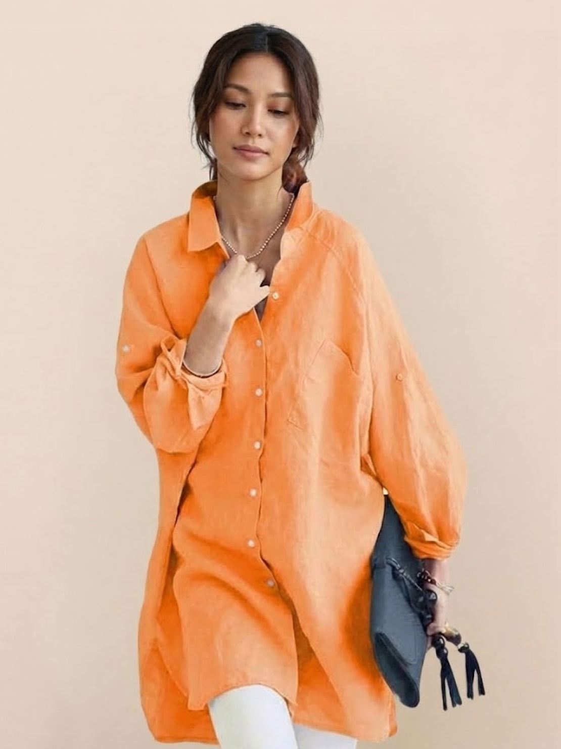 Oversized linen shirt in soft white cotton-linen blend with relaxed fit and back button details