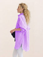 Oversized linen shirt made from breathable cotton-linen blend with relaxed fit and back button details