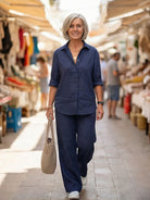 Model wearing oversized 100% cotton shirt and wide-leg pants co-ord set in relaxed silhouette