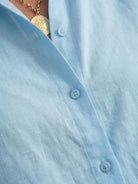 Woman wearing oversized 100% cotton shirt with wide-leg pants co-ord set in relaxed silhouette