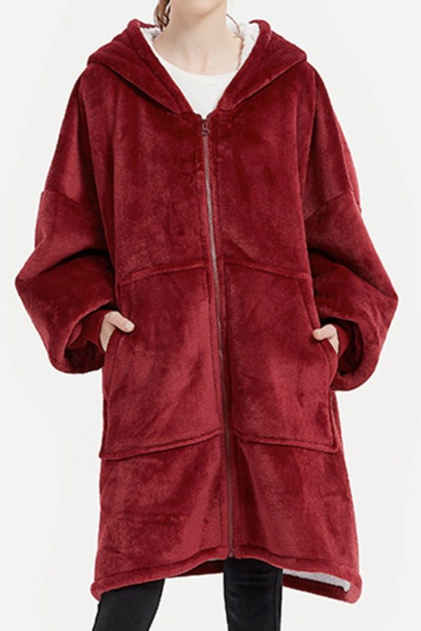 Oversized ultra soft hooded blanket in deep red with front zipper and large pockets for extra warmth and comfort