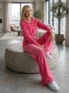 Modern velour tracksuit set with cropped hoodie and high-waist pants in plush polyester fabric