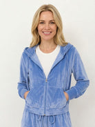 Modern cropped velour tracksuit with high-waist pants in vibrant color and plush texture