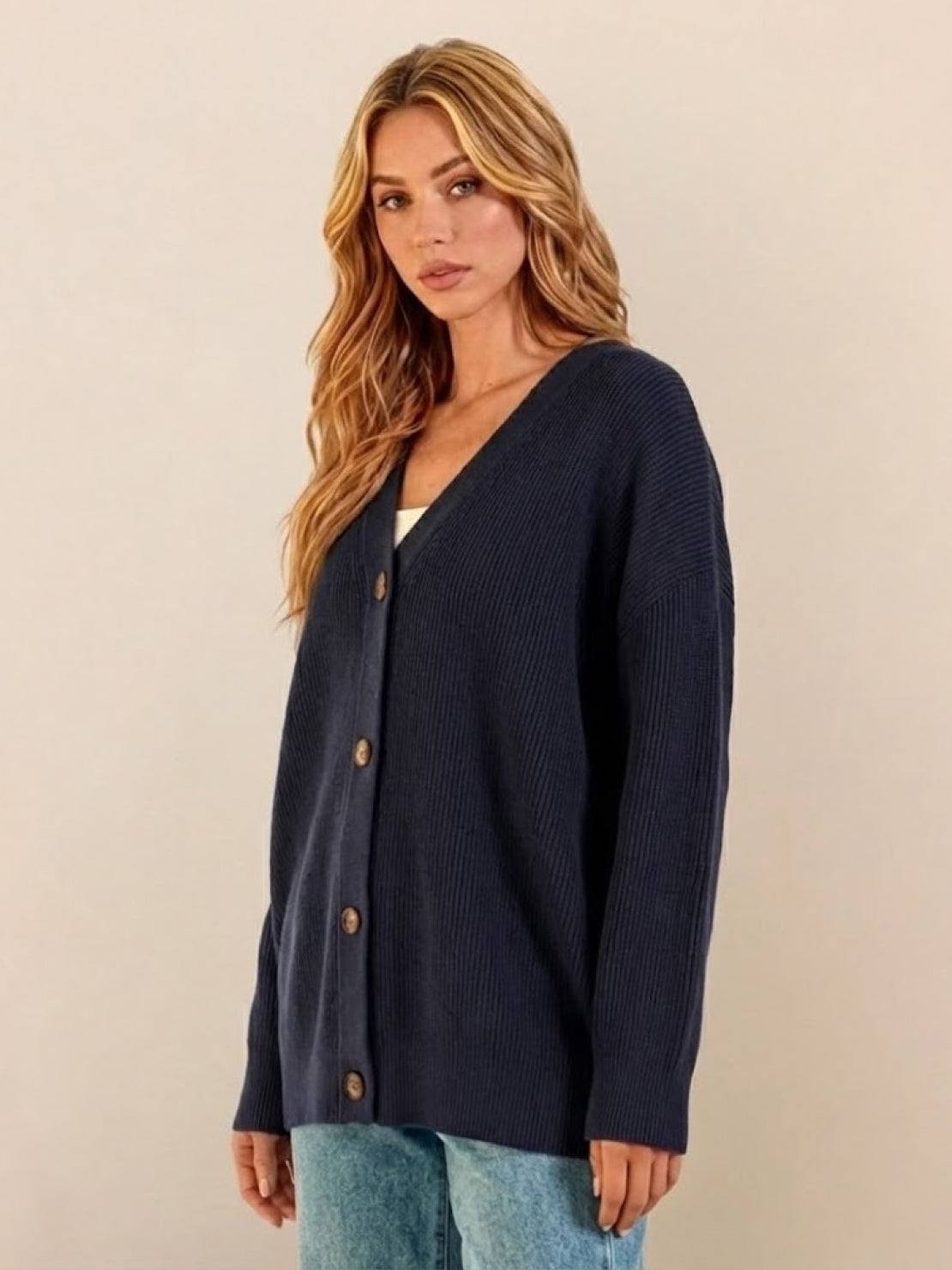 relaxed fit oversized navy blue button down knit cardigan on woman