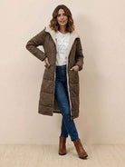 woman wearing brown sherpa-lined hooded teddy coat with pockets and blue jeans