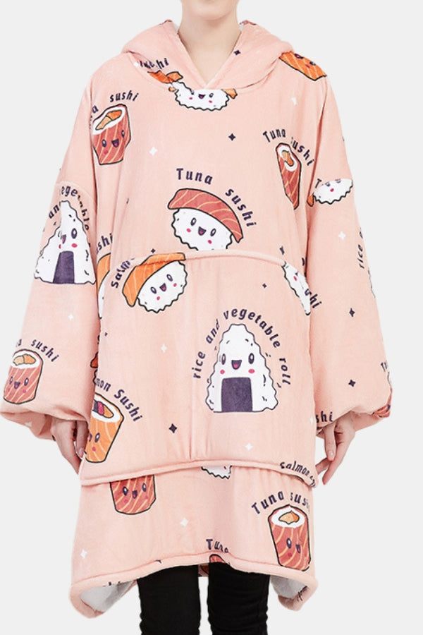 Pink snuggly oversized hooded fleece sweater with cartoon sushi and rice roll print, front pocket, and cozy blanket fit.