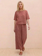 Loose fit co-ord set featuring a soft-tailored top with wide sleeves and wide-leg trousers in breathable cotton blend fabric