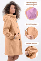 Rain Couture Windbreaker oversized water-resistant beige jacket with adjustable hood, stylish pockets, and cuffed sleeves