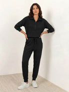 Unisex half-zip pullover and matching sweatpants set in soft fabric for casual comfort