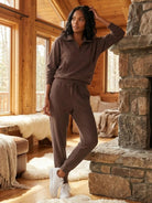 Unisex half-zip pullover and matching sweatpants set in relaxed fit with soft fabric for casual wear and travel