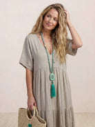 V-neck two-tiered maxi swing dress in flowing cotton fabric with irregular hemline and draped sleeves