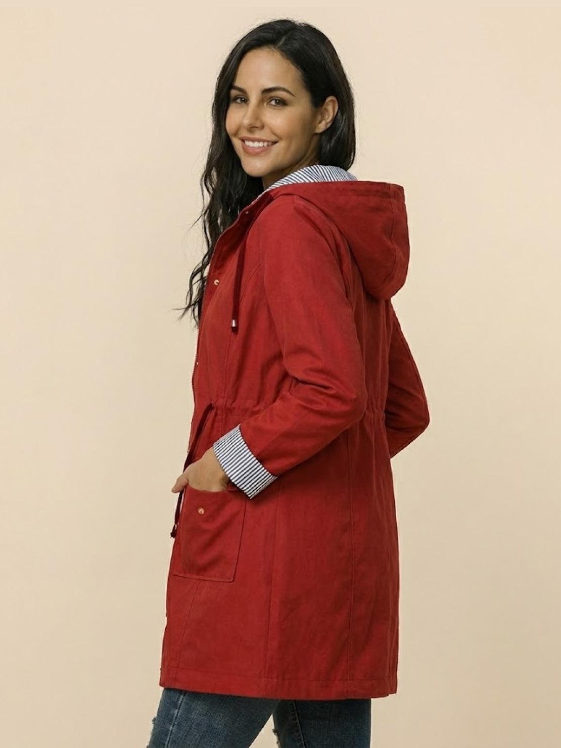 Women's water resistant windbreaker jacket with hood in red and striped inner lining