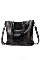Black multi strap tote shopper bag in PU leather with multiple compartments and adjustable shoulder and crossbody straps