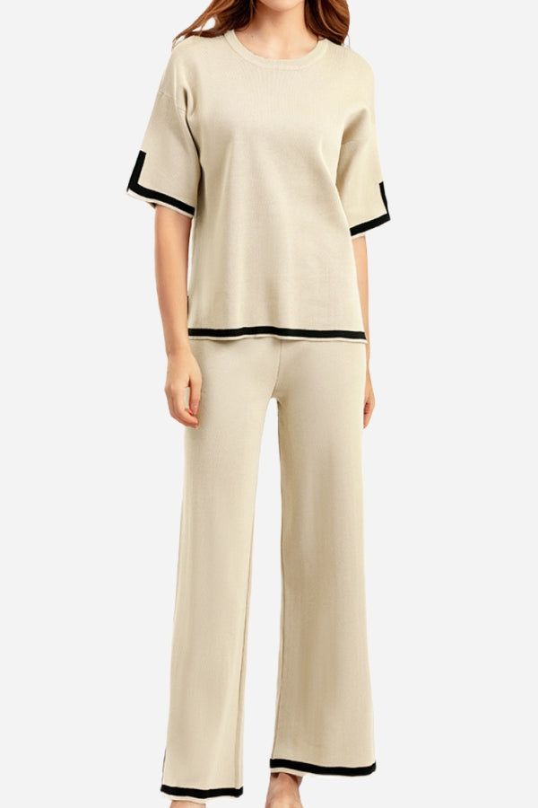 Beige short sleeved relaxed fit lounge two-piece set with black trim on sleeves and pant hems