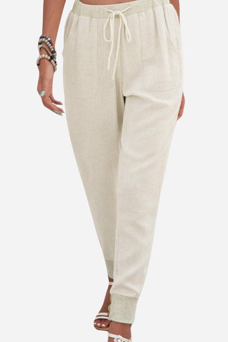 Women's relaxed chic elastic ankle pants in beige with drawstring waist and side pockets