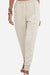 Women's relaxed chic elastic ankle pants in beige with drawstring waist and side pockets